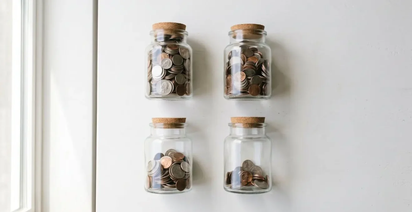 Physical representation of sinking funds strategy with multiple savings containers for different future expenses