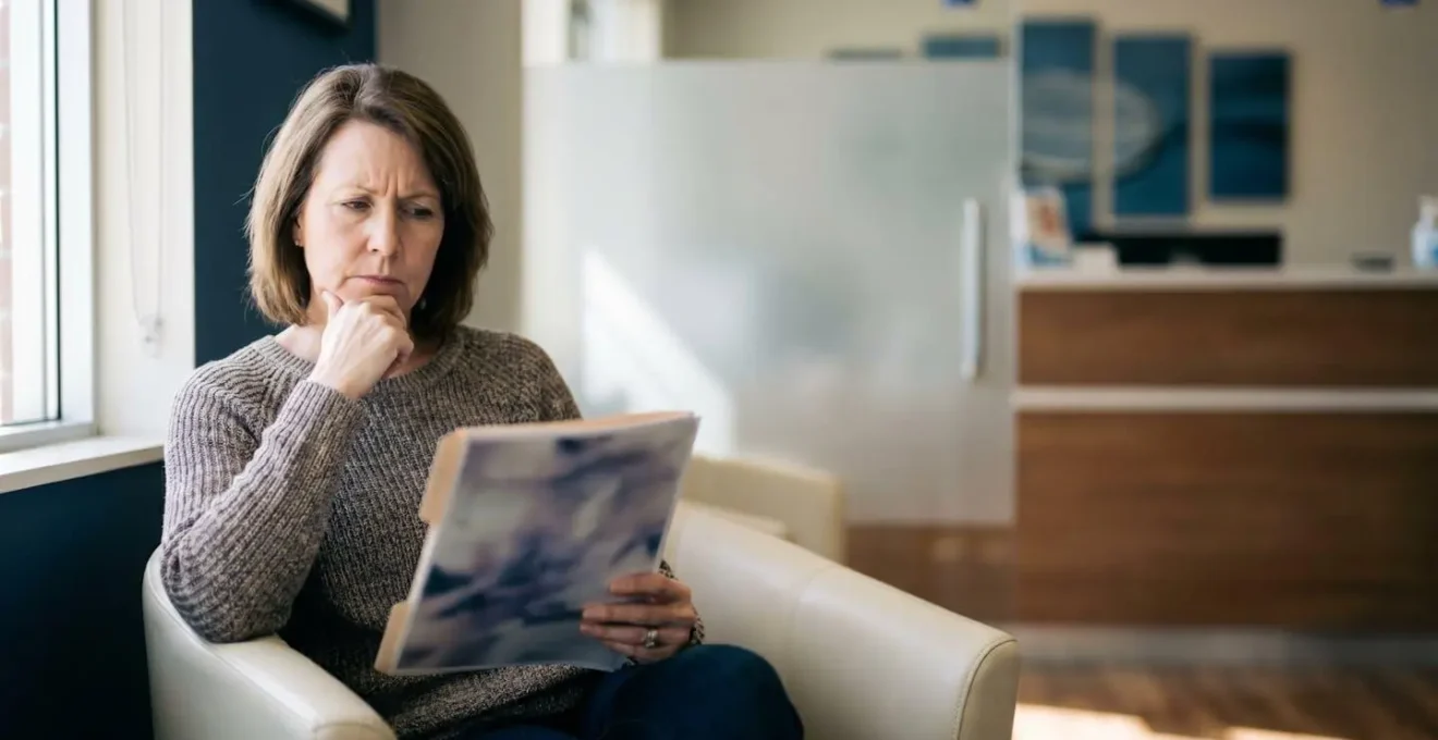 Patient contemplating dental insurance options in modern UK dental setting