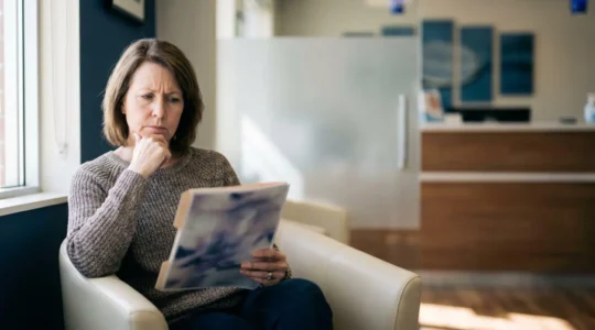 Patient contemplating dental insurance options in modern UK dental setting