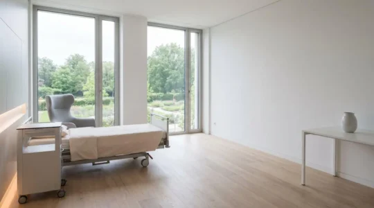 Modern private hospital room with natural light emphasizing patient privacy and comfort